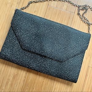 Pebbled black and white crossbody / clutch